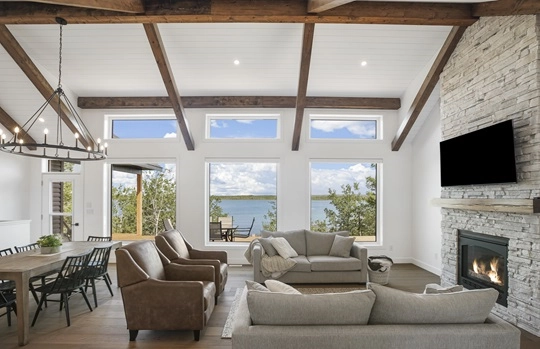 living room design with rustic wooden beams and stone fireplace
